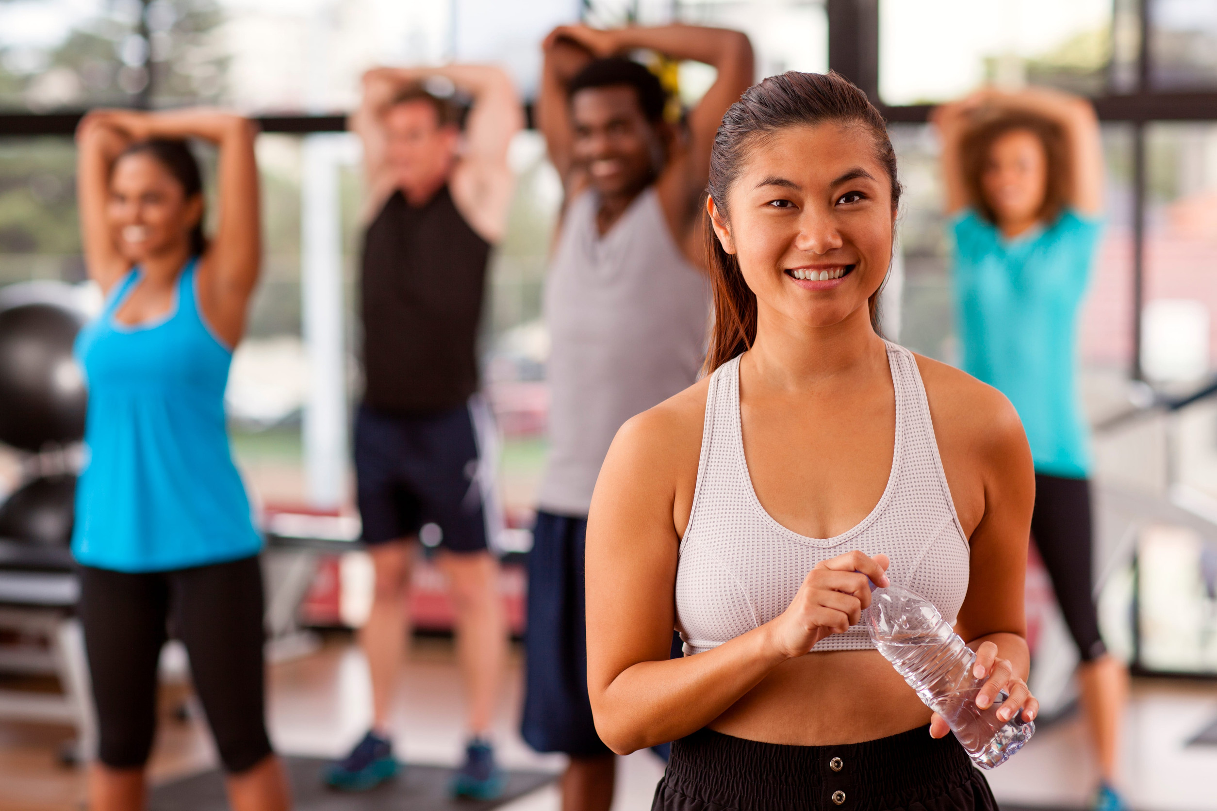 Young Asian woman in a gym preparing to exercise